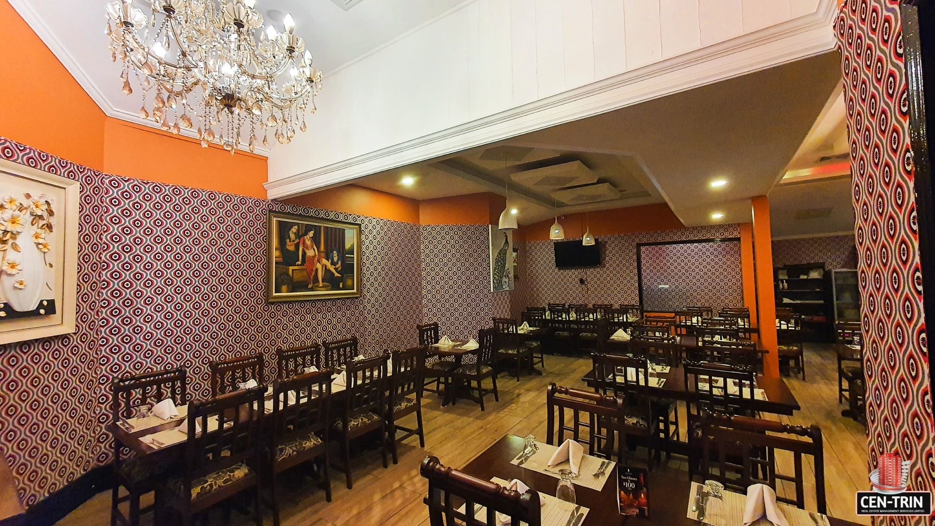 Restaurant interior with red leather booths and patterned flooring. "Prime Restaurant Space"