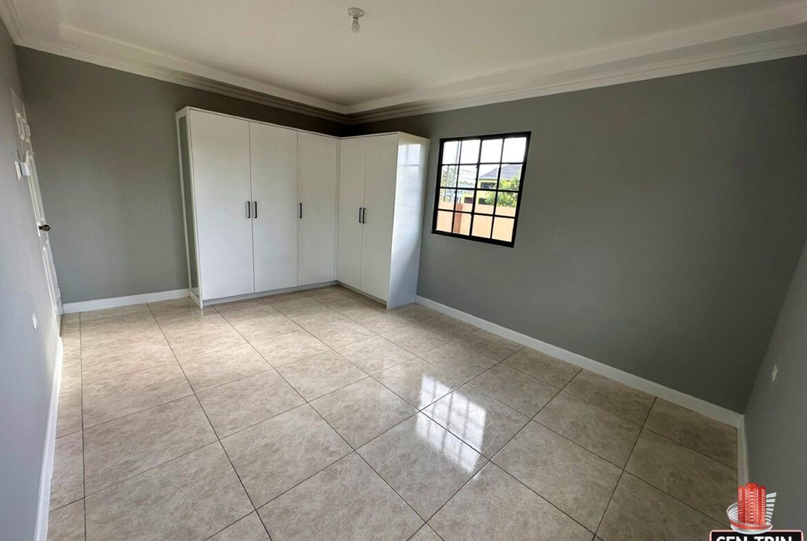 Empty, fitted wardrobe with white doors