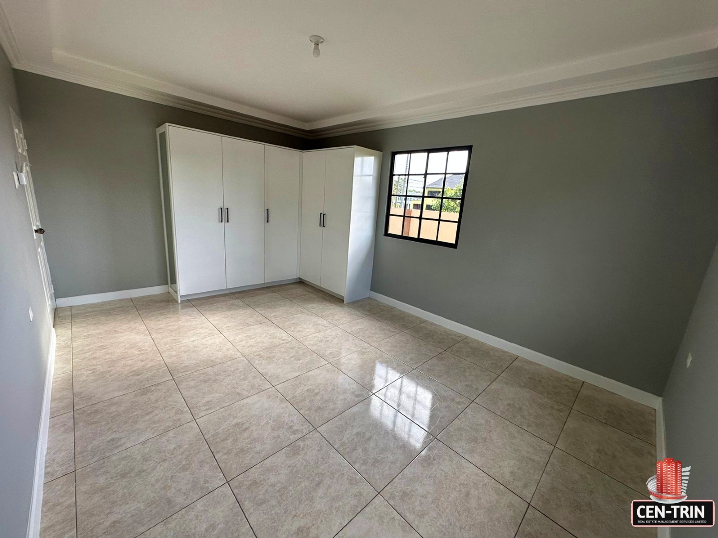 Empty, fitted wardrobe with white doors