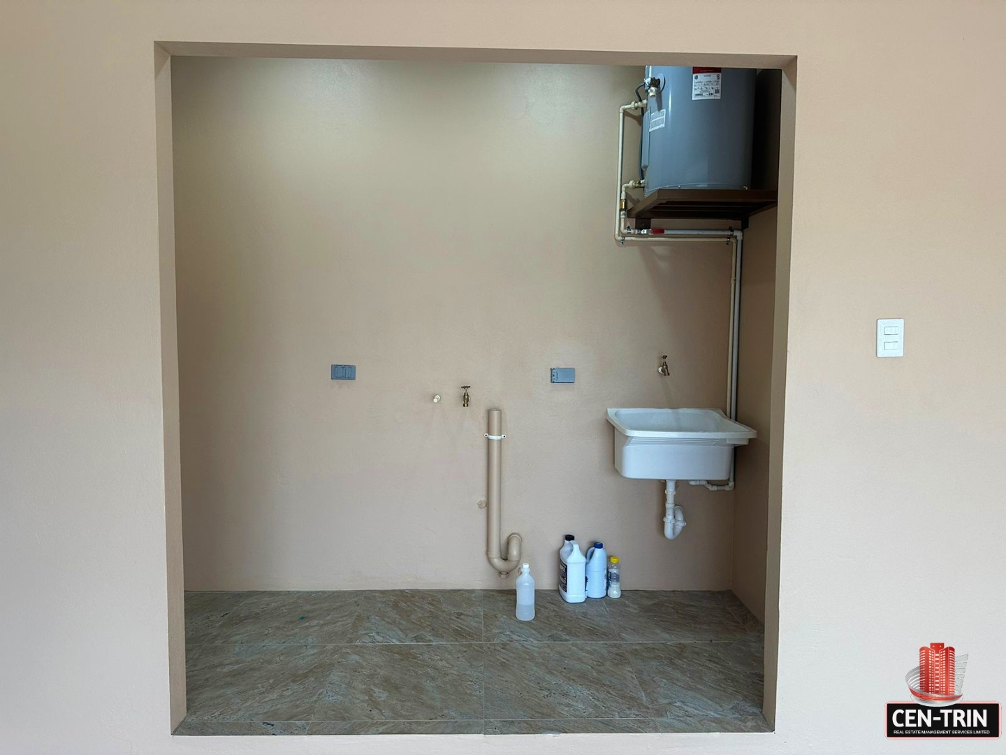 Laundry room with a sink, water heater, and washer and dryer