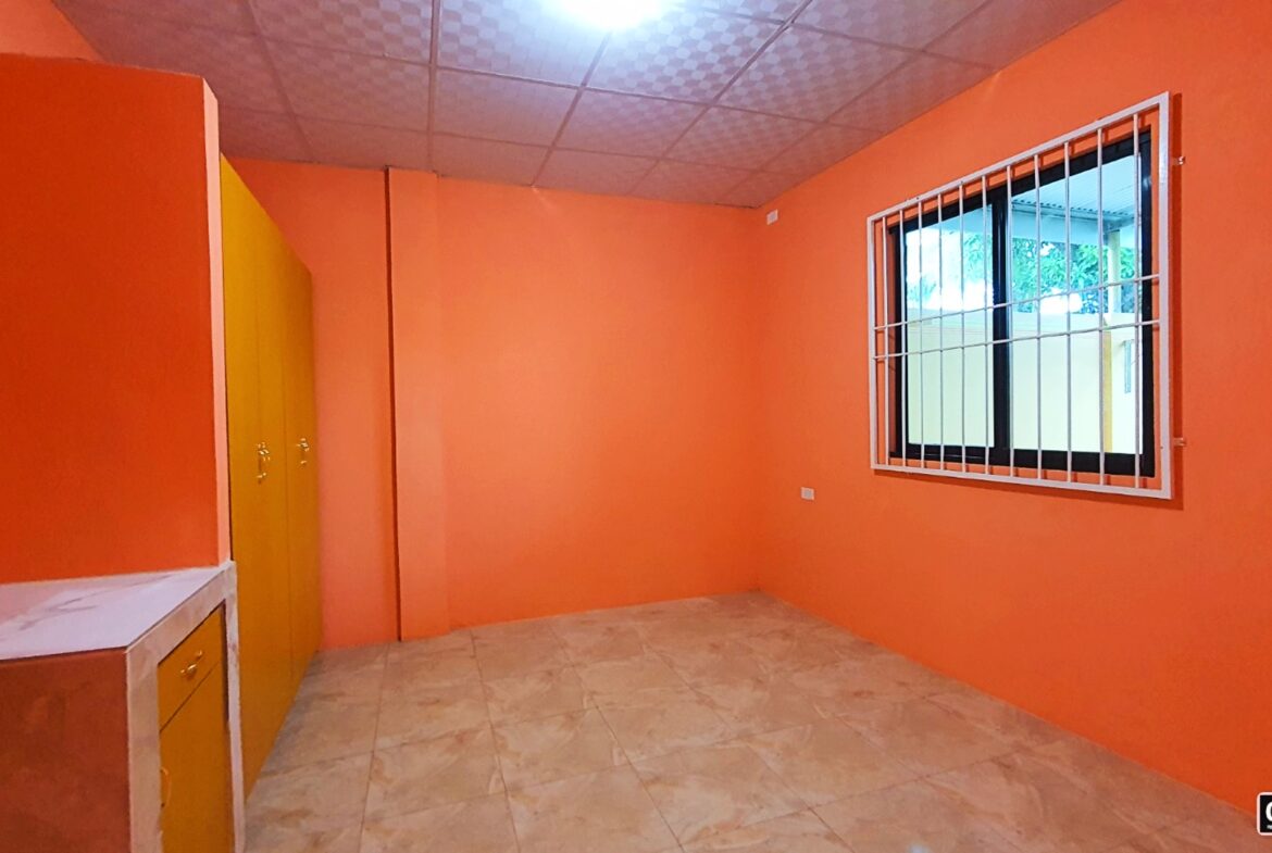 Image of an orange room with a window
