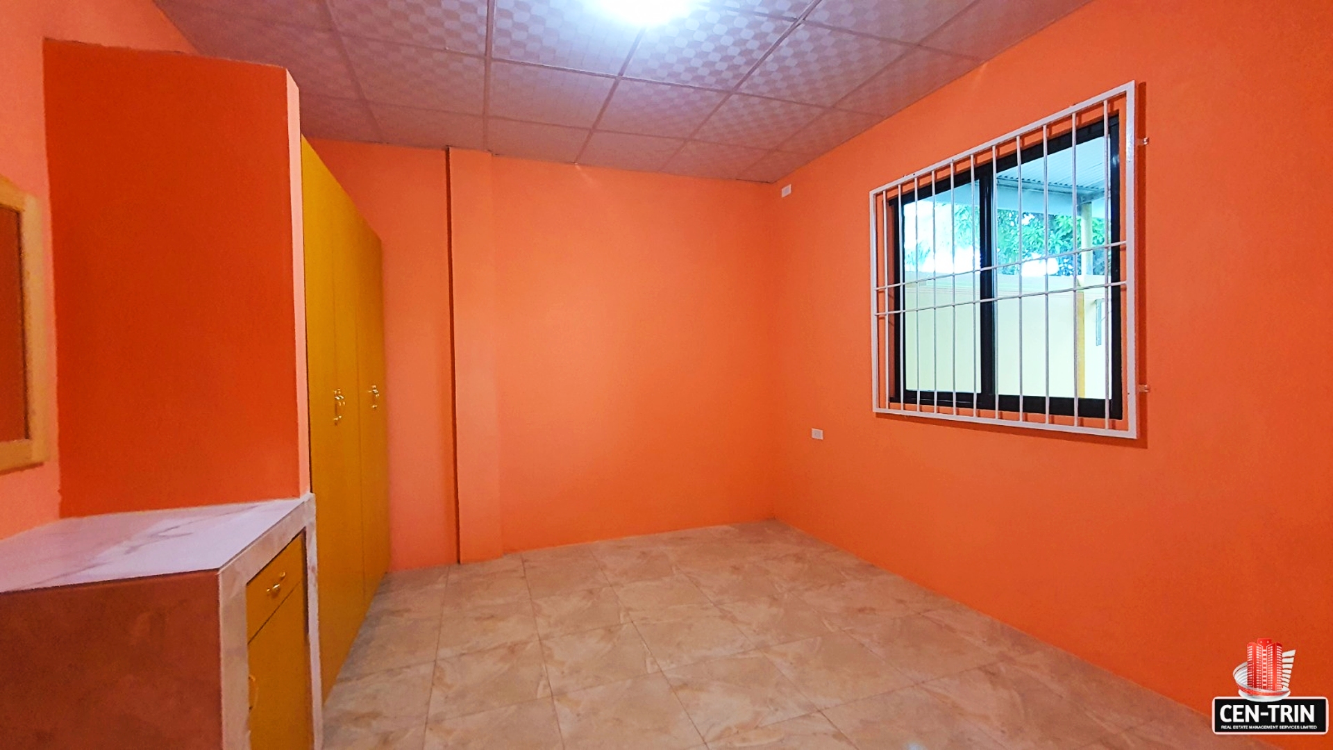 Image of an orange room with a window