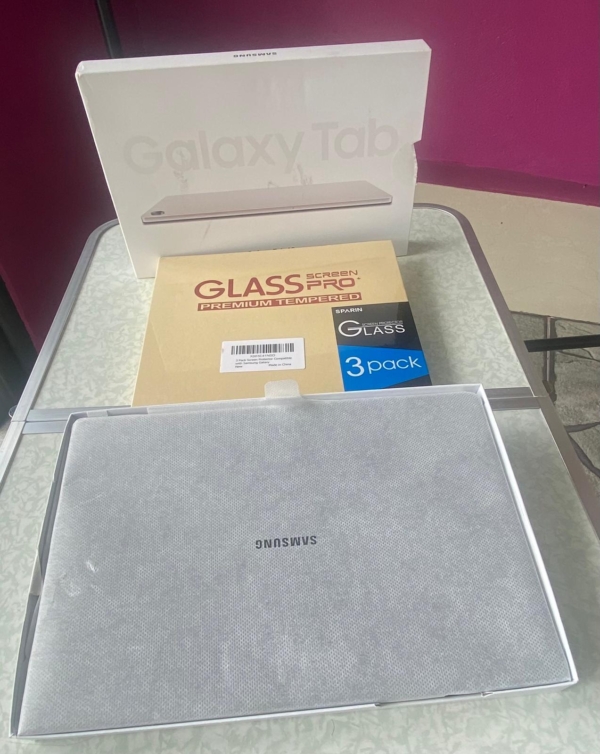 A Samsung Galaxy Tab A9+ tablet with a clear tempered glass screen protector, showcasing its sleek design and vibrant display.