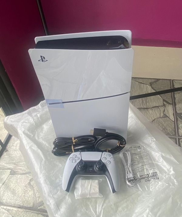 Open box Sony PS5 for sale in Trinidad, featuring the console, controllers, and accessories.